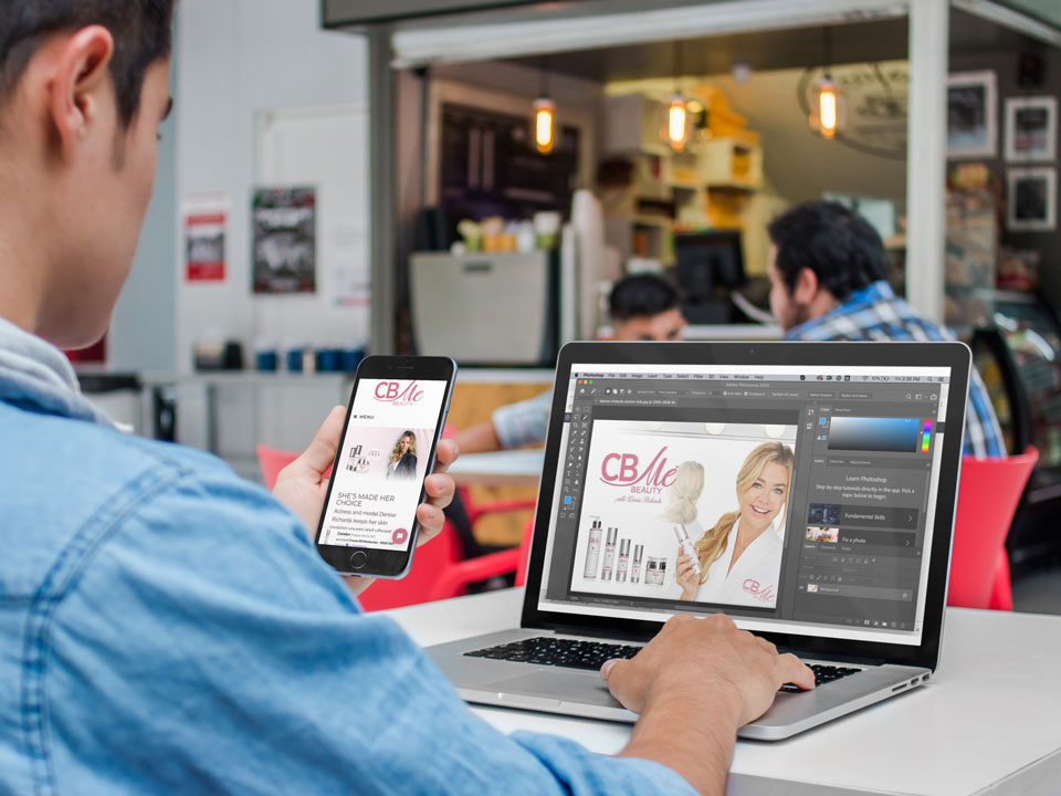 iphone-and-macbook-mockup-of-a-young-man-at-the-cafeteria-a4635